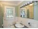 Cozy bathroom with tiled walls, a sink, and a bright window at 1270 N Enochville Ave, China Grove, NC 28023