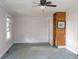 Bedroom featuring window, built-in shelves and ceiling fan at 1270 N Enochville Ave, China Grove, NC 28023