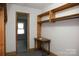 Walk-in closet with built-in wooden shelves and a small table at 1270 N Enochville Ave, China Grove, NC 28023