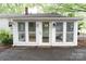 View of home's exterior showcasing a sunroom entrance at 1270 N Enochville Ave, China Grove, NC 28023