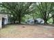 Home exterior shot with mature trees and a spacious yard at 1270 N Enochville Ave, China Grove, NC 28023