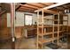 This is a garage interior including exposed beams, peg boards, shelving and tool storage at 1270 N Enochville Ave, China Grove, NC 28023
