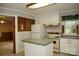 Well-lit kitchen with classic appliances and a view to the living room at 1270 N Enochville Ave, China Grove, NC 28023