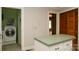 Cozy kitchen featuring a functional island and convenient laundry area at 1270 N Enochville Ave, China Grove, NC 28023