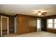 Classic living room design with wood-paneled walls and carpeted floors at 1270 N Enochville Ave, China Grove, NC 28023