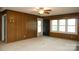 Spacious living room featuring wood paneled walls and a large window at 1270 N Enochville Ave, China Grove, NC 28023