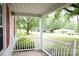 Charming front porch with white railing and vibrant red shutters at 1270 N Enochville Ave, China Grove, NC 28023