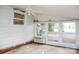This is an additional view of the bright sunroom with large windows and white painted walls at 1270 N Enochville Ave, China Grove, NC 28023