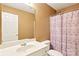 Bathroom with beige walls featuring a white vanity and a shower and tub combo at 14018 Drake Watch Ln, Charlotte, NC 28262