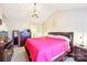 Primary bedroom with vaulted ceiling, bedside tables, and carpet at 14018 Drake Watch Ln, Charlotte, NC 28262