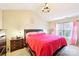 Primary bedroom with vaulted ceiling, bedside tables, and window at 14018 Drake Watch Ln, Charlotte, NC 28262