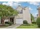 Inviting two-story home featuring a one car garage and manicured lawn at 14018 Drake Watch Ln, Charlotte, NC 28262