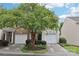 Charming two-story home with a well maintained lawn and vibrant landscaping at 14018 Drake Watch Ln, Charlotte, NC 28262