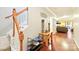 Inviting foyer featuring hardwood floors, staircase, and stylish decor at 14018 Drake Watch Ln, Charlotte, NC 28262