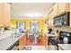Open kitchen and dining area with a view of the living area at 14018 Drake Watch Ln, Charlotte, NC 28262