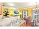 View of the kitchen opening to a dining and living area at 14018 Drake Watch Ln, Charlotte, NC 28262