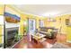 Bright living room with a fireplace, hardwood floors, and access to the patio at 14018 Drake Watch Ln, Charlotte, NC 28262