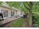 Cozy patio area perfect for outdoor dining and relaxation, complete with seating and a grill at 14018 Drake Watch Ln, Charlotte, NC 28262