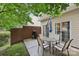 Patio with outdoor seating, grill and wooded surroundings at 14018 Drake Watch Ln, Charlotte, NC 28262