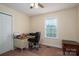Well-lit bedroom offers a closet and a workspace with a ceiling fan and natural light at 1483 Dawnview Ln, Lincolnton, NC 28092