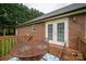 Cozy outdoor deck features stylish metal furniture with easy access from double doors at 1483 Dawnview Ln, Lincolnton, NC 28092