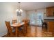 Inviting dining room features hardwood floors and access to outdoor space at 1483 Dawnview Ln, Lincolnton, NC 28092