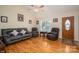 Comfortable living room with hardwood floors, a ceiling fan, and a front door view at 1483 Dawnview Ln, Lincolnton, NC 28092