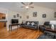 Open living room featuring hardwood floors, a ceiling fan, and a neutral color scheme at 1483 Dawnview Ln, Lincolnton, NC 28092