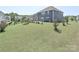 Expansive backyard with mature landscaping, a fenced perimeter and a patio area, ideal for relaxation at 151 Outrigger Ln, Troutman, NC 28166