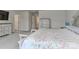 This bedroom showcases a lovely upholstered headboard, soft carpet, and access to other rooms at 151 Outrigger Ln, Troutman, NC 28166