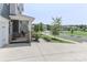 Charming home exterior with a covered porch, landscaped yard and a welcoming neighborhood street at 151 Outrigger Ln, Troutman, NC 28166