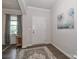 Inviting foyer with hardwood floors, elegant decor, and a view of the home's interior at 151 Outrigger Ln, Troutman, NC 28166
