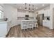 Bright kitchen features a large island, stainless appliances, and stylish pendant lighting at 151 Outrigger Ln, Troutman, NC 28166