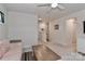 Comfortable living room featuring neutral walls, carpeted floors, and a striped couch at 151 Outrigger Ln, Troutman, NC 28166