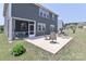 Outdoor patio area with seating, a grill, and a screened-in porch, great for outdoor gatherings at 151 Outrigger Ln, Troutman, NC 28166
