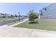 Street view showing a well-maintained neighborhood with sidewalks and mature trees at 151 Outrigger Ln, Troutman, NC 28166