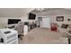 Well-lit bonus room with multiple workstations, a TV, and a cozy seating area at 15737 Agincourt Dr, Huntersville, NC 28078