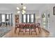 Bright dining room with gray curtains, unique light fixture and view to office space at 15737 Agincourt Dr, Huntersville, NC 28078