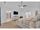 This light and airy main bedroom features neutral walls, carpet, and an en-suite bath and sitting area at 15737 Agincourt Dr, Huntersville, NC 28078