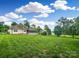 Sprawling backyard showcasing lush greenery and a charming residence with a screened porch at 1625 Damascus Cir, Conover, NC 28613