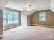 Large bedroom featuring neutral decor, a ceiling fan, and windows offering natural light at 1625 Damascus Cir, Conover, NC 28613