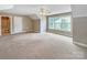 Spacious bedroom with plush carpet, natural light, and an ensuite bathroom at 1625 Damascus Cir, Conover, NC 28613