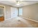 This cozy bedroom features plush carpet, a ceiling fan, and a window for natural light at 1625 Damascus Cir, Conover, NC 28613