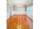 Elegant dining room with hardwood floors, decorative molding, and natural light from a large window at 1625 Damascus Cir, Conover, NC 28613