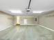 Spacious two-car garage with ample storage space, overhead lighting, and neutral paint at 1625 Damascus Cir, Conover, NC 28613