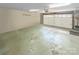 Clean and organized two-car garage with overhead door, lighting, and concrete floor at 1625 Damascus Cir, Conover, NC 28613