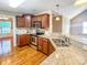 Modern kitchen with stainless appliances, granite countertops, and beautiful hardwood floors at 1625 Damascus Cir, Conover, NC 28613