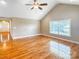 Bright living room with vaulted ceilings, hardwood floors, and large windows offering natural light at 1625 Damascus Cir, Conover, NC 28613