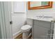 Bathroom with marble vanity and paneled walls at 1645 Brookdale Ave, Charlotte, NC 28210