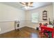 Bedroom with wood floor, window and red desk at 1645 Brookdale Ave, Charlotte, NC 28210